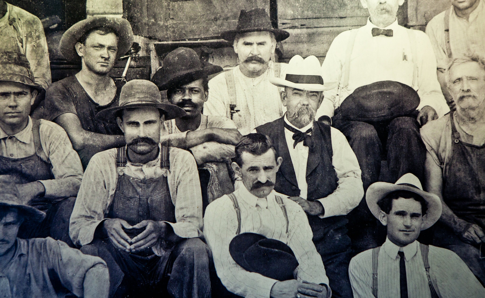 Historic image of Jack Daniel seated next to George Green, the son of Nathan "Nearest" Green, the man who taught Jack Daniel how to make whiskey.. 1870. Unknown author, Public domain, via Wikimedia Commons